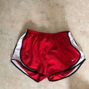 Red Nike running shorts